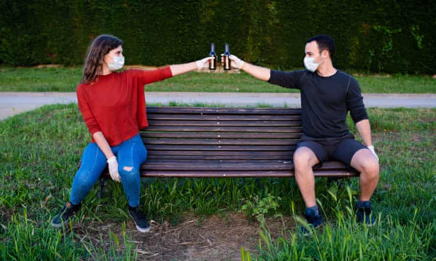 A man and a woman on a park bench