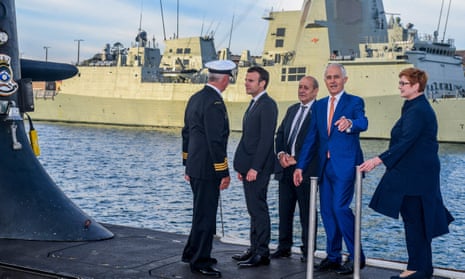Emmanuel Macron, second left, in 2018 with the then Australian Prime Minister, Malcolm Turnbull,  second right, on a  submarine in Sydney.