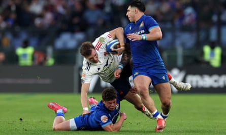 Léo Barré is tackled by Alessandro Garbisi and Tommaso Menoncello.
