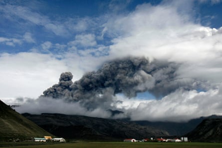 Farms are dwarfed by a plume of ash rising from a volcano erupting under the Eyjafjallajökull glacier in Iceland in 2010.