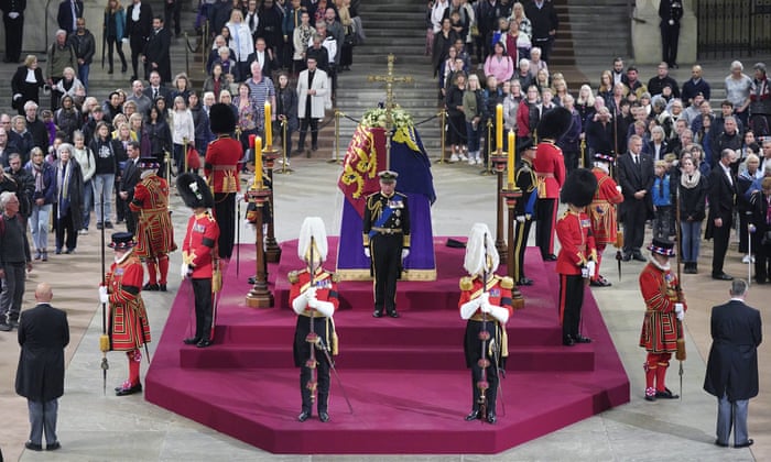 Members of the public file past as King Charles III, the Princess Royal, the Duke of York and the Earl of Wessex hold a vigil beside the coffin of their mother, Queen Elizabeth II.