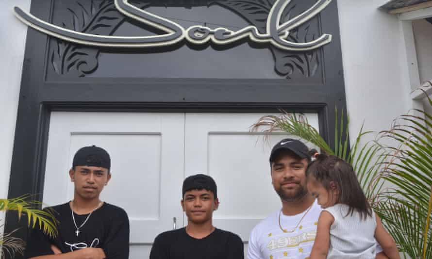 Caleb Tatuava, owner of Soul Cafe and Barbershop with his daughter and two staff members Tyree Kamana and Terry Peraua.