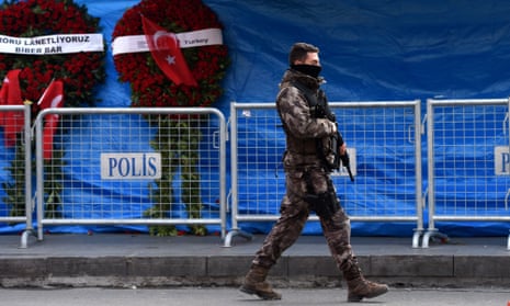 A Turkish police officer patrols at the Reina nightclub in Istanbul, three days after a gunman killed 39 people. Abdurakhmon Uzbeki, who was linked to the attack, has been killed by US forces in Syria.