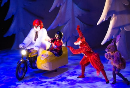 In The Snowman stage show, a snowman rides a motorbike sidecar past costumed fox and rabbit characters