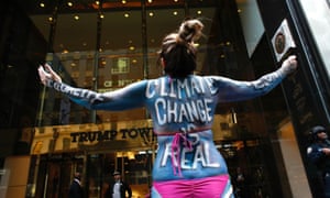 A woman protests against climate change outside the Trump Tower in New York.