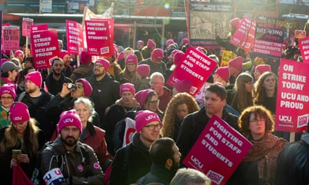 Thousands of striking workers and their supporters attend a rally at Kings Cross station called by the UCU on 30 November 2022 in London, England.