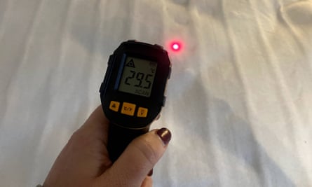 Emily measures the heat of the Slumberdown electric blanket – our best budget electric blanket buy