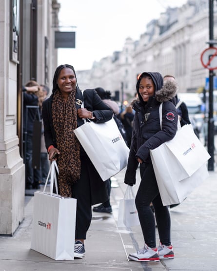 Jerry and Amy Oki holding large Rabanne H&M bags