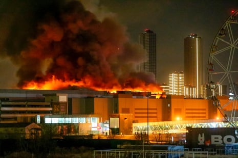 A massive blaze is seen over the Crocus City Hall on the western edge of Moscow, Russia, Friday, March 22, 2024.