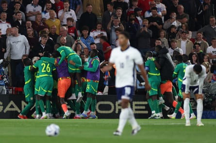 Senegal players celebrate against England.