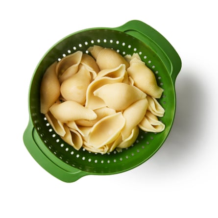 A colander of drained pasta. Put the pasta on to boil. Meanwhile, toast the pine nuts in a small pan until lightly golden, then set aside.