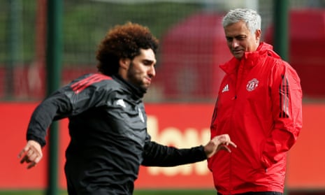 José Mourinho watches Marouane Fellaini in training