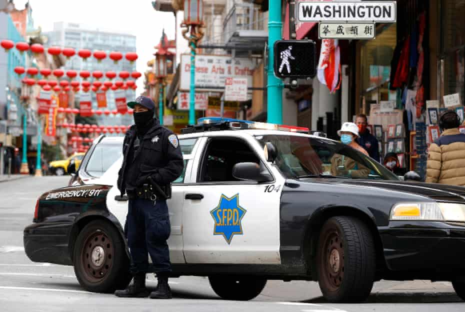 San Francisco police patrol the Chinatown neighborhood on 18 March.