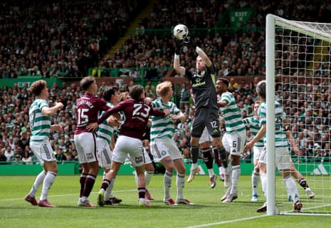 Celtic's keeper Viljami Sinisalo plucks the ball out of the air.