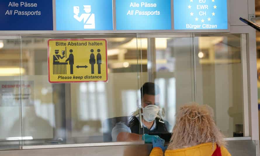 A Romanian woman arrives at Frankfurt airport last year for seasonal farm work in Germany, which has tightened rules on subcontracting in meat plants.