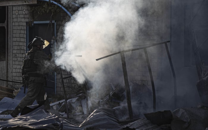 Firefighters try to extinguish a fire near an industrial site in Donetsk.