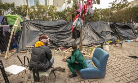 People in makeshift accommodation in Tunisia.