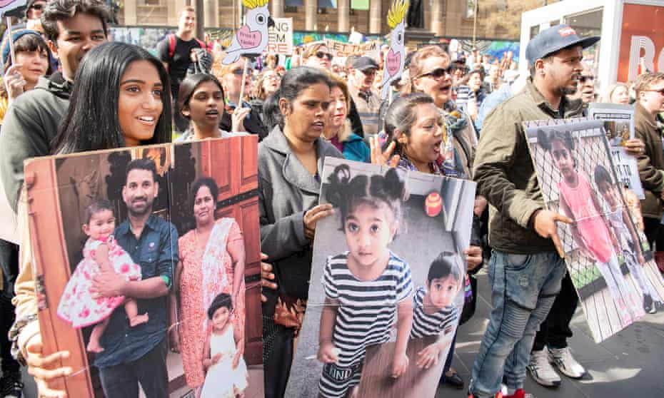 Supporters of Tamil asylum seekers Nadesalingam, Priya and their Australian-born children Kopika and Tharunicaa are seen at a rally in Melbourne in September 2019.