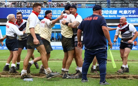 Great Britain are visibly emotional after the men’s outdoor 640kg gold medal match against Switzerland at the tug of war event at the 2025 World Games in Chengdu, China