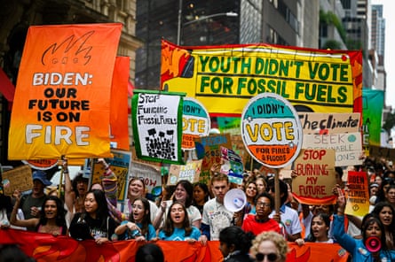 Climate activists attend the march against fossil fuels in New York City on 17 September.
