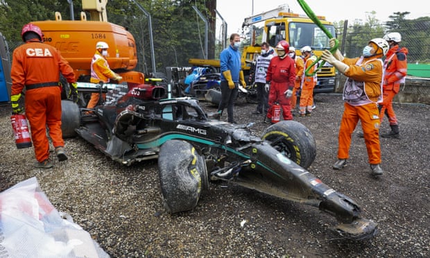 Trackside workers clear the Mercedes of Valtteri Bottas after the Finn’s crash with George Russell at the Emilia Romagna F1 Grand Prix
