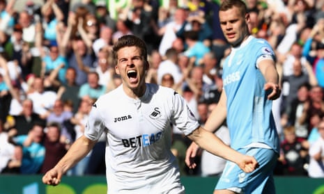 Tom Carroll celebrates scoring Swansea’s second goal against Stoke.