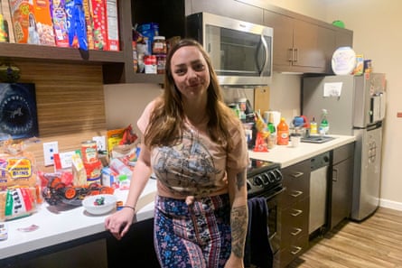 A woman stands in a kitchen