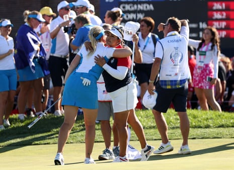 Matilda Castren of Team Europe hugs Lizette Salas of Team USA on the 18th hole after winning.