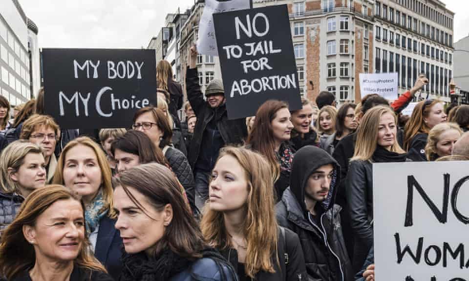 Polish women protest against a legislative proposal for a total ban on abortion in Poland, during a demonstration near EU headquarters in Brussels, Monday, Oct. 3, 2016. 