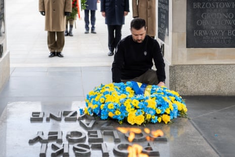 Volodymyr Zelenskiy lays flowers at the tomb of the unknown soldier in Warsaw, Poland.