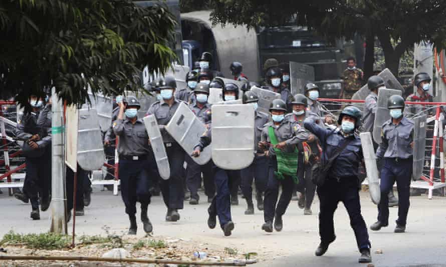 Police march towards protesters