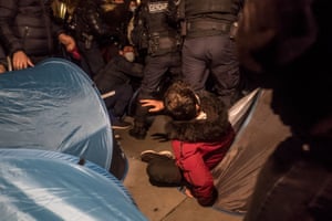 The police remove tents to clear the Place de la Republique