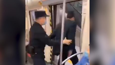 Unmasked man pulled off metro in China amid coronavirus crisis – video 