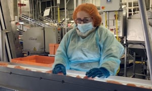 Screengrab from a video issued by Tyson Foods Inc on 28 April 2020 showing including workers wearing masks at meat processing plant during the coronavirus pandemic.