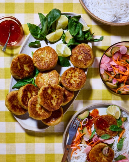 Poppy O’Toole’s lemongrass and ginger Thai-style fish cakes on a platter, with a prepared plate nearby and other ingredients on the table