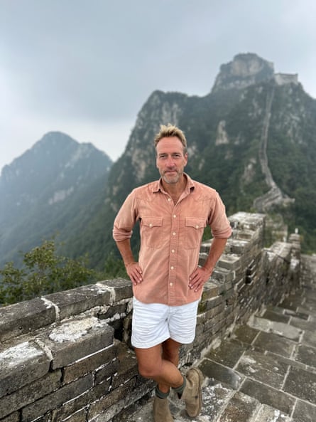 Ben Fogle dressed in shorts standing on part of the Great Wall of China
