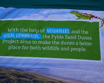 Banner on the beach describing conservation project