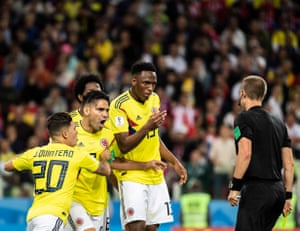 Colombia’s Yerry Mina, Radamel Falcao and Juan Fernando Quintero confront referee Mark Geiger during the round of 16 match against England at Spartak Stadium.