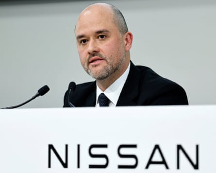 Ivan Espinosa head and shoulder shot with Nissan sign below