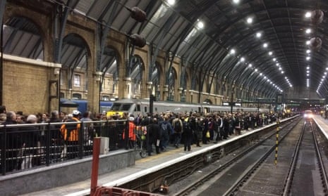 Crowds wait for a train at King’s Cross Station in London. 