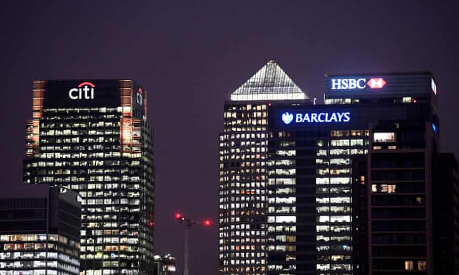 Office blocks of Citi, Barclays, and HSBC banks at dusk in the Canary Wharf financial district in London