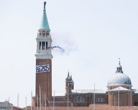 Huge church with giant banner with Bezos’s name crossed out