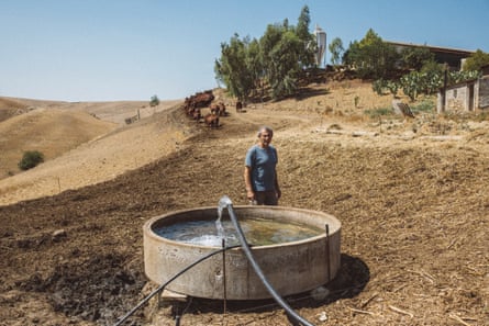 Liborio Mangiapane stands in a parched landscape
