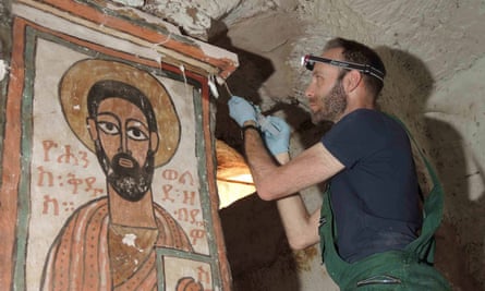 Stephen Rickerby carrying out conservation treatment in one of the painted churches.