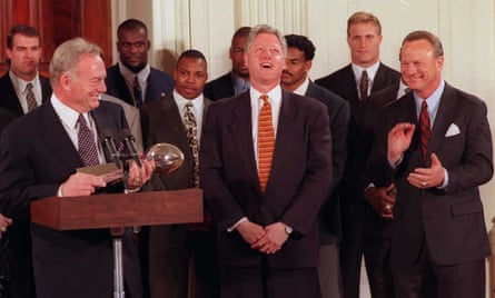 Cowboys owner Jerry Jones, left, holds the Super Bowl trophy as he makes a comment to then-US president Bill Clinton during a 1996 ceremony for their Super Bowl XXX win.