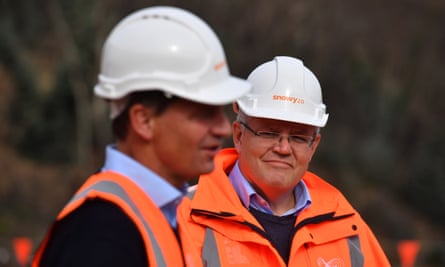 two white men in hard hats and fluoro safety vests