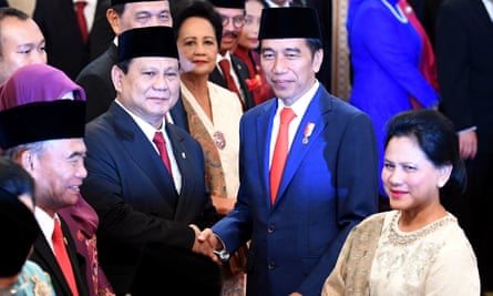 Indonesian Defense Minister Prabowo Subianto is congratulated by Indonesian President Joko Widodo, as first lady Iriana Widodo stands next to them, after the swearing-in ceremony during the inauguration at the Presidential Palace in Jakarta, Indonesia, 23 October 2019