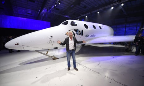 Sir Richard Branson poses in front of Virgin Galactic’s SpaceShipTwo space tourism rocket after it was unveiled on Friday in Mojave, California.