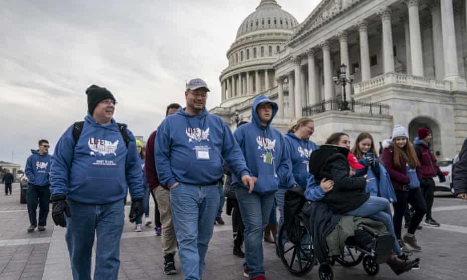 As the impeachment trial of Donald Trump is conducted inside the Senate, activists attending the March for Life anti-abortion rally visit the Capitol in Washington on Thursday.