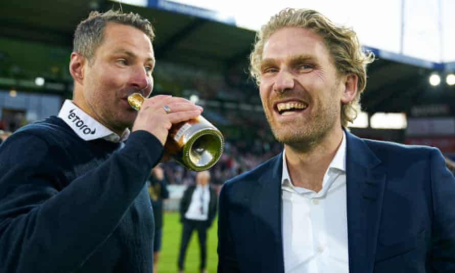 Brian Priske, head coach, and Rasmus Ankersen, president, celebrate Midtjylland’s title success in July
